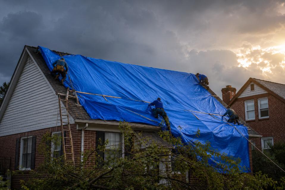Emergency roof tarping after a storm in Silver Spring, Maryland
